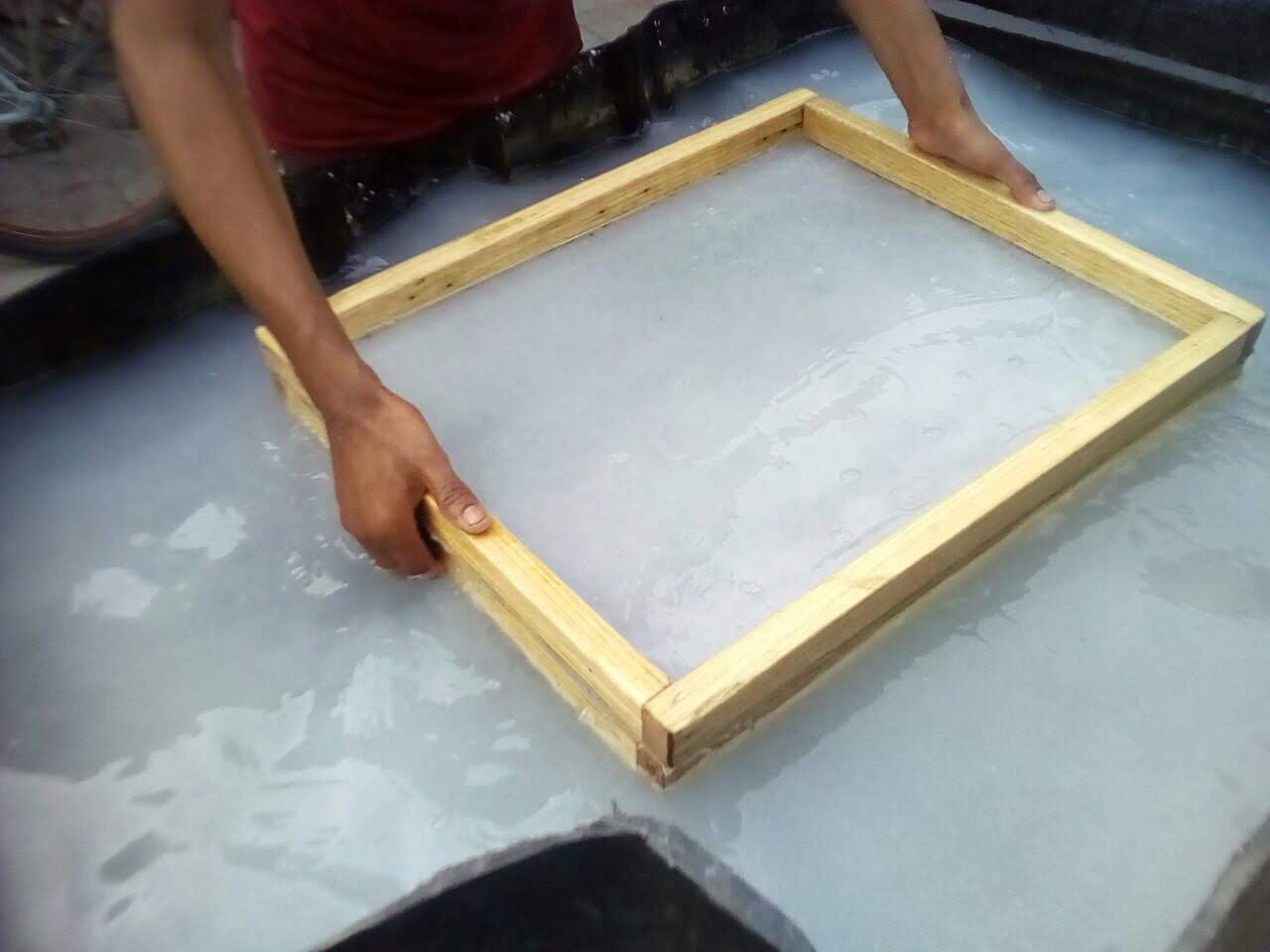 Making paper using wood deckles